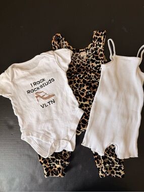 Baby Outfits… leopard onesie….. rock stud onesie…. And little knit onesie.